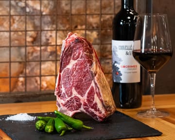 Friesian beef txuletón on a slate board
